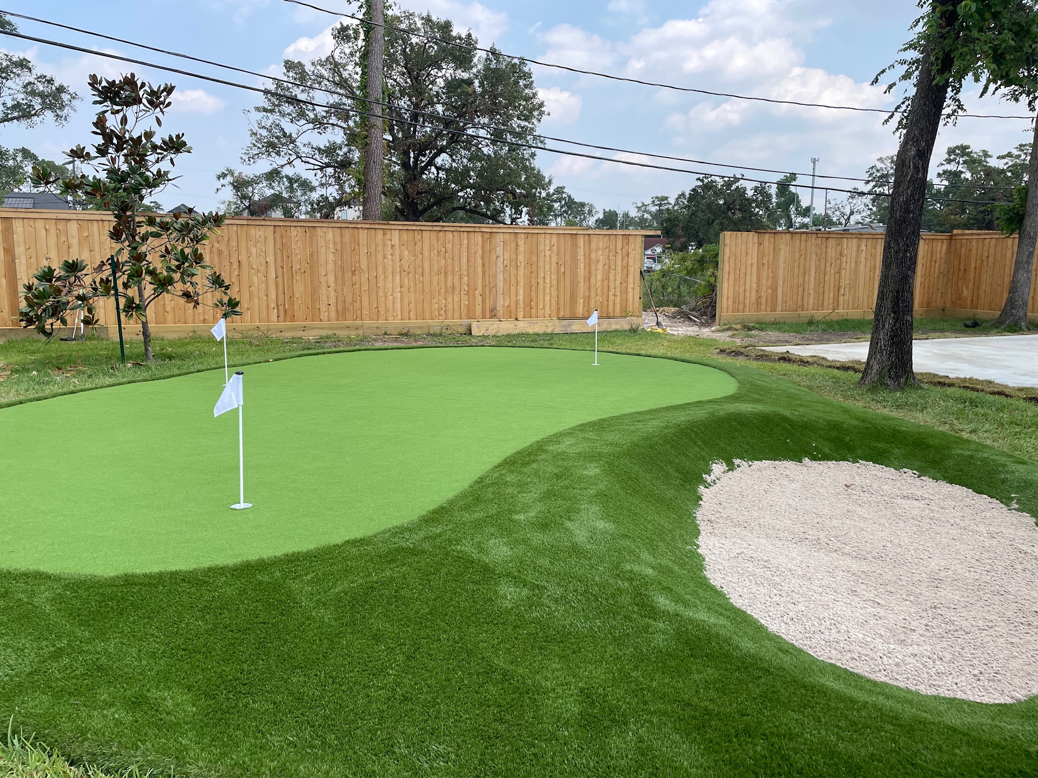 Custom synthetic putting green installation process